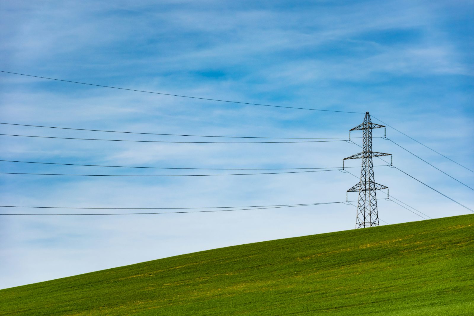Electricity pylons on a British hillside